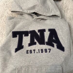 TNA Heather Gray Hoodie with Dark Blue Logo